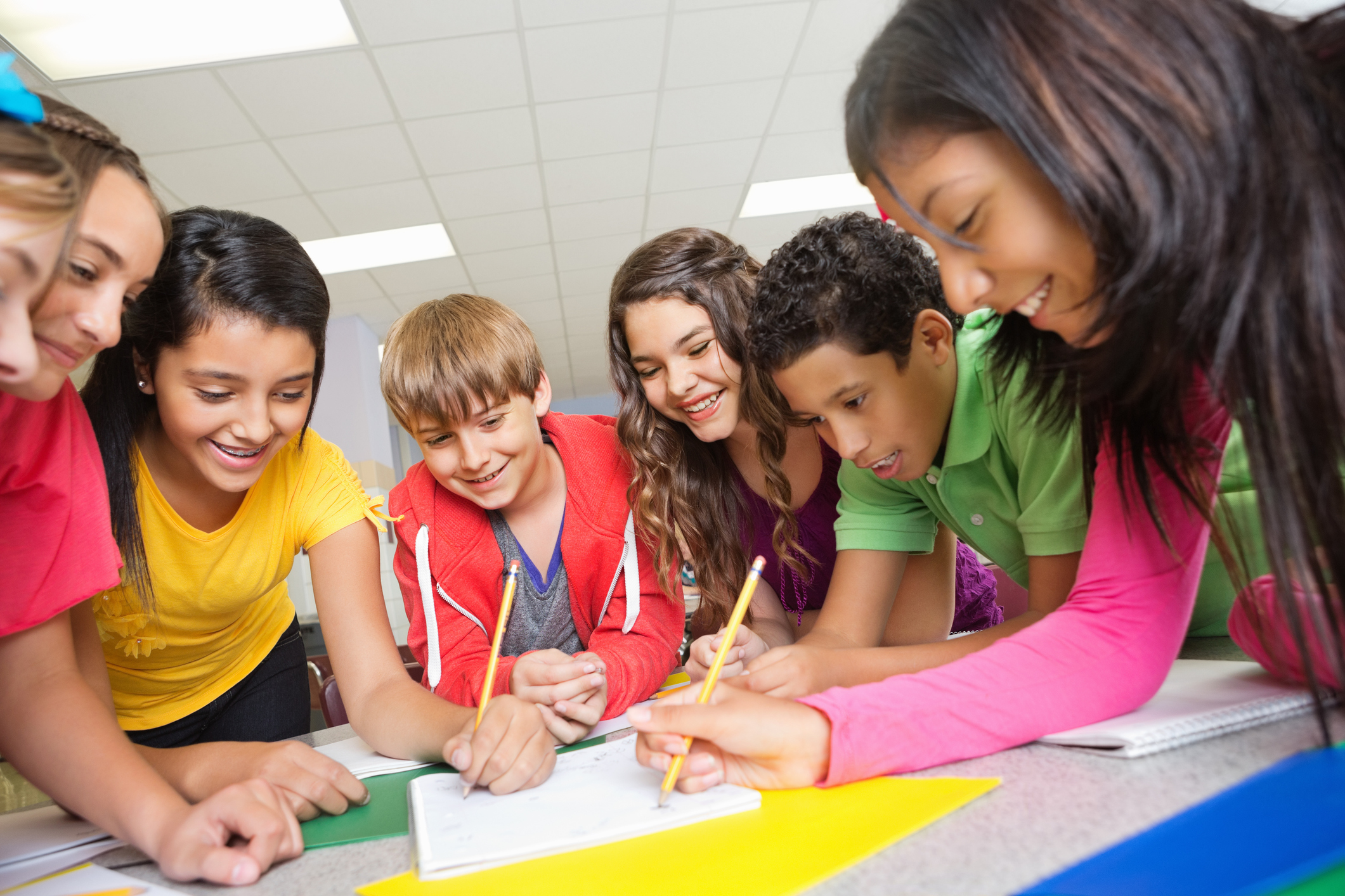 group of students around table