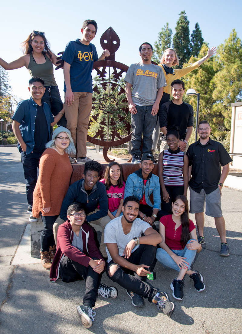 students with turtle sculpture