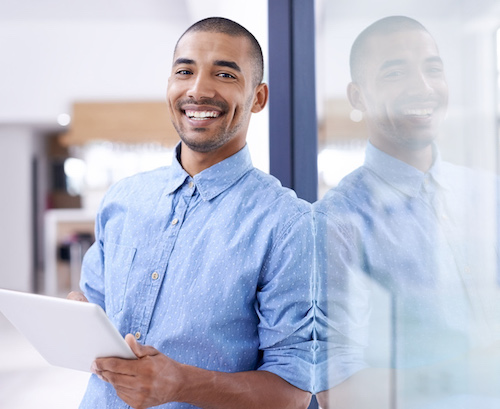 smiling young man in blue dress shirt