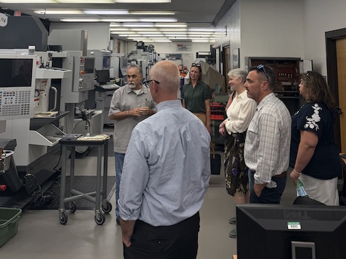 visitors touring DMT classroom